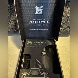 Black Stanley cross bottle with strap